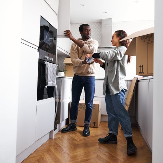 couple-having-fun-moving-into-new-home