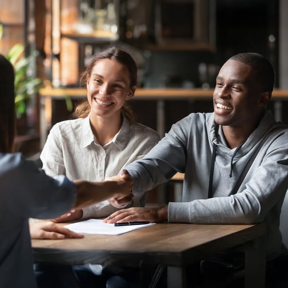 young-couple-greeting-loan-officer